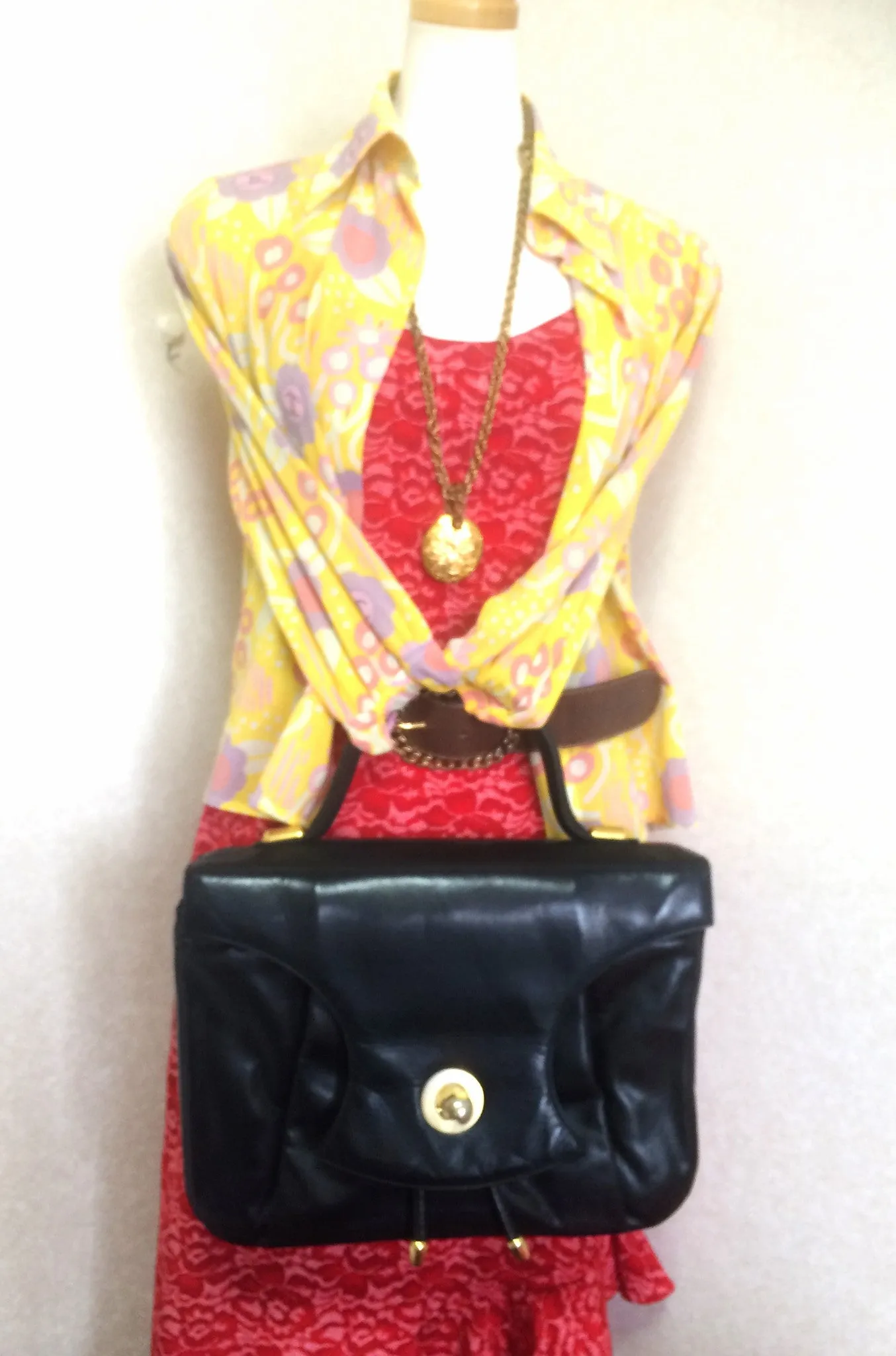 Vintage Bally black leather retro pop design bag, business purse with gold tone drawstrings and unique flap cut design.  Unisex use. 160315