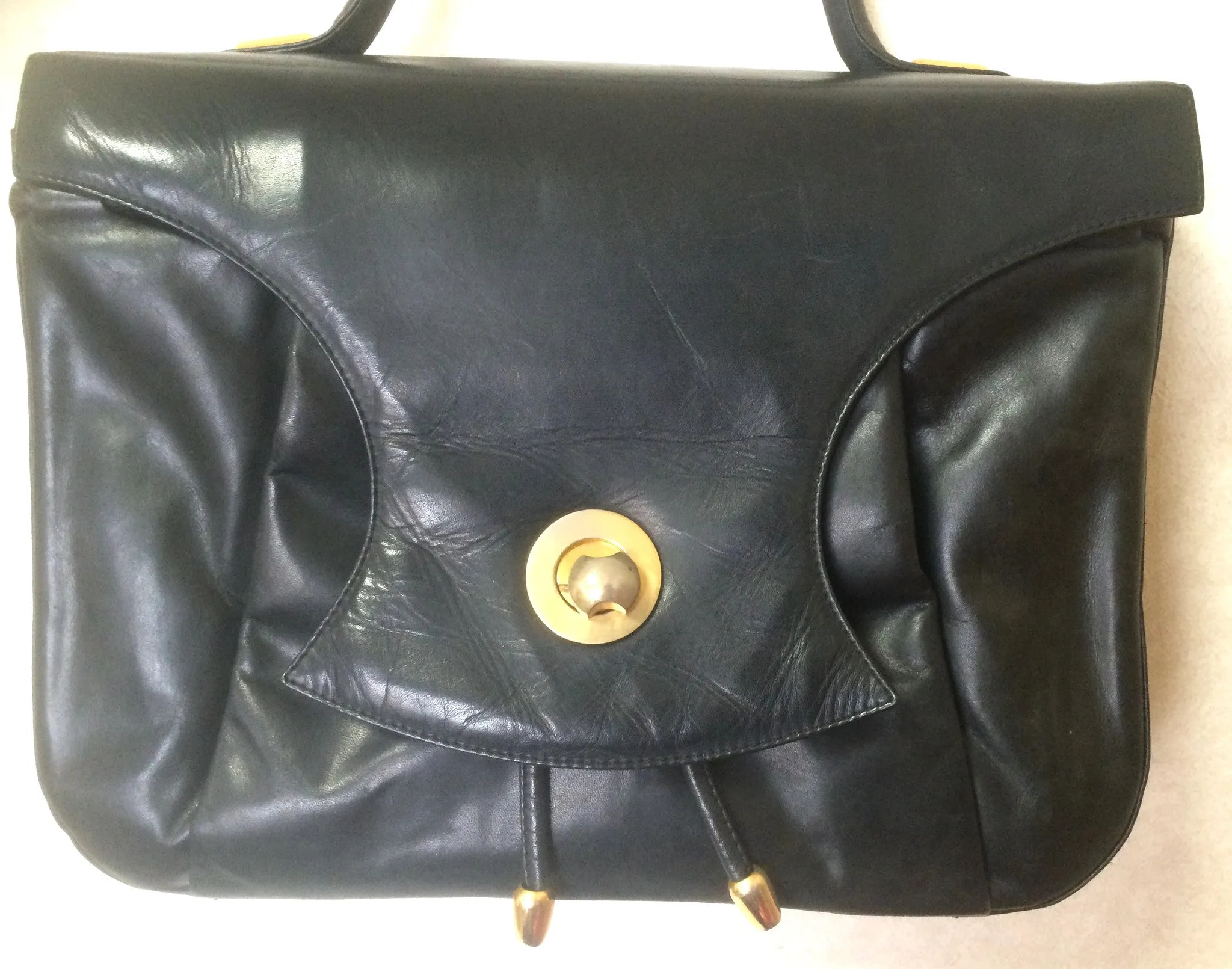 Vintage Bally black leather retro pop design bag, business purse with gold tone drawstrings and unique flap cut design.  Unisex use. 160315