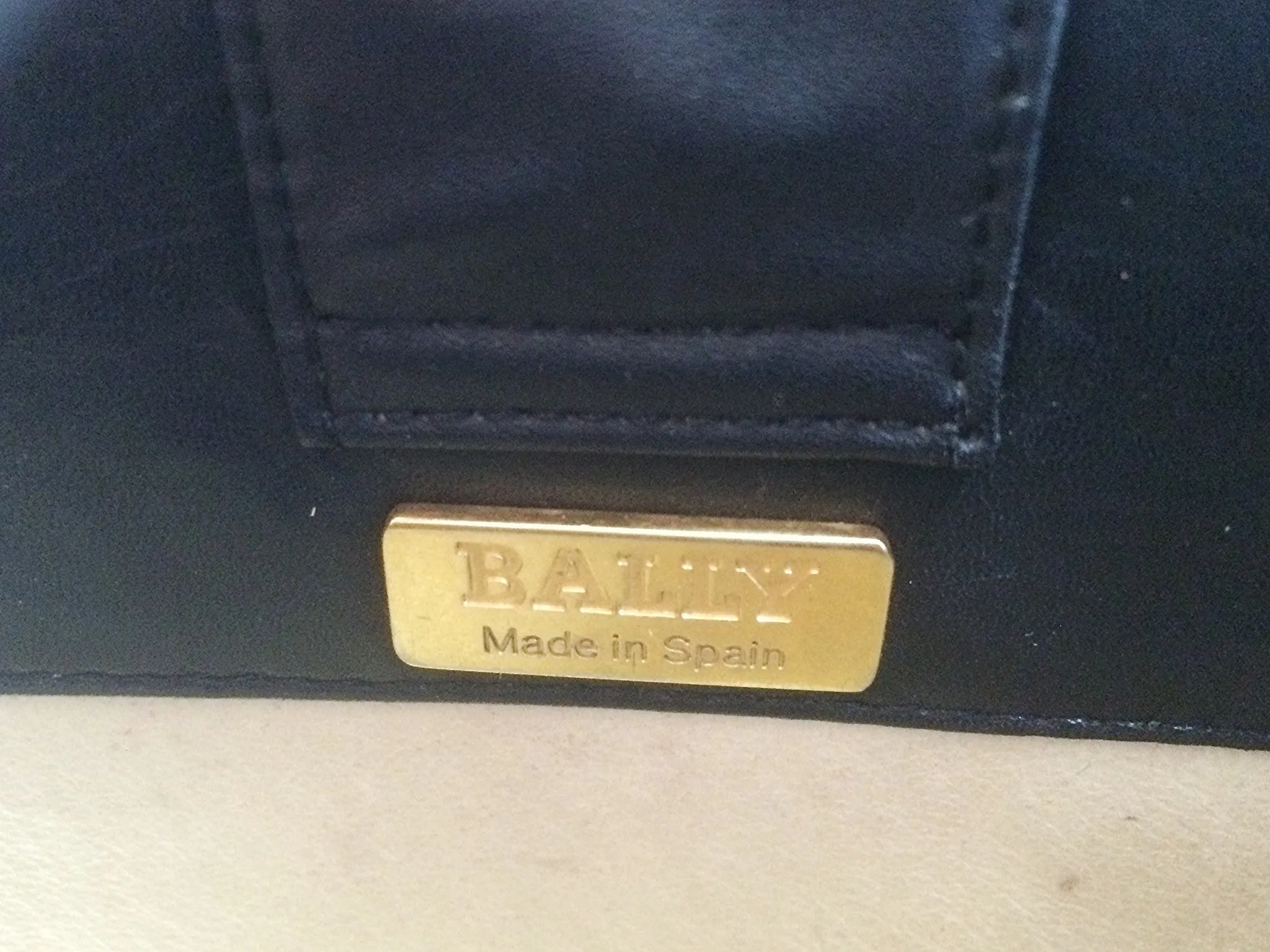 Vintage Bally black leather retro pop design bag, business purse with gold tone drawstrings and unique flap cut design.  Unisex use. 160315