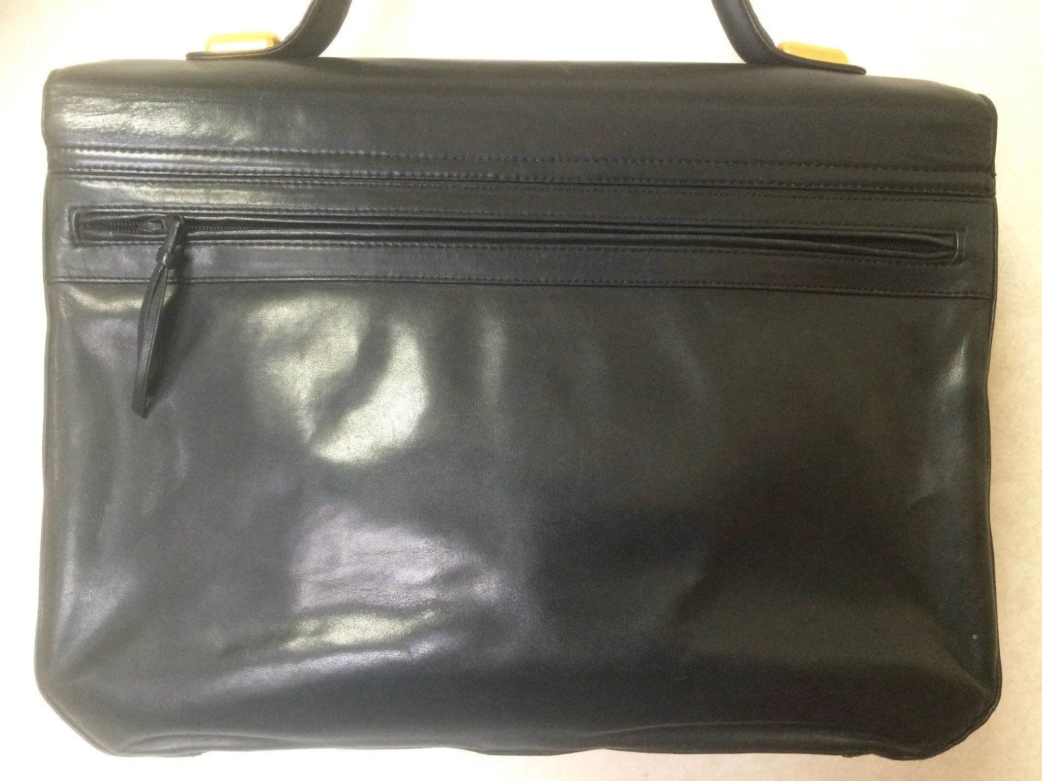 Vintage Bally black leather retro pop design bag, business purse with gold tone drawstrings and unique flap cut design.  Unisex use. 160315