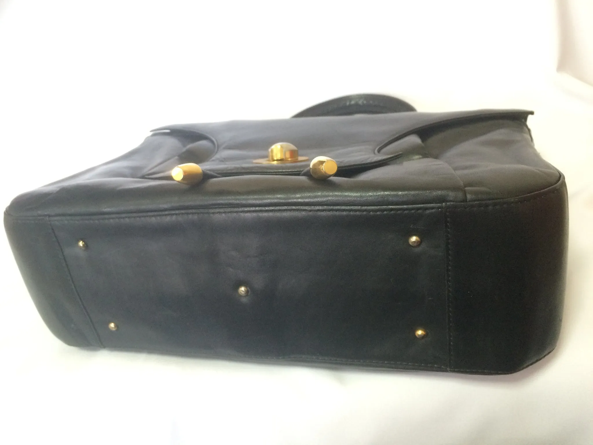 Vintage Bally black leather retro pop design bag, business purse with gold tone drawstrings and unique flap cut design.  Unisex use. 160315