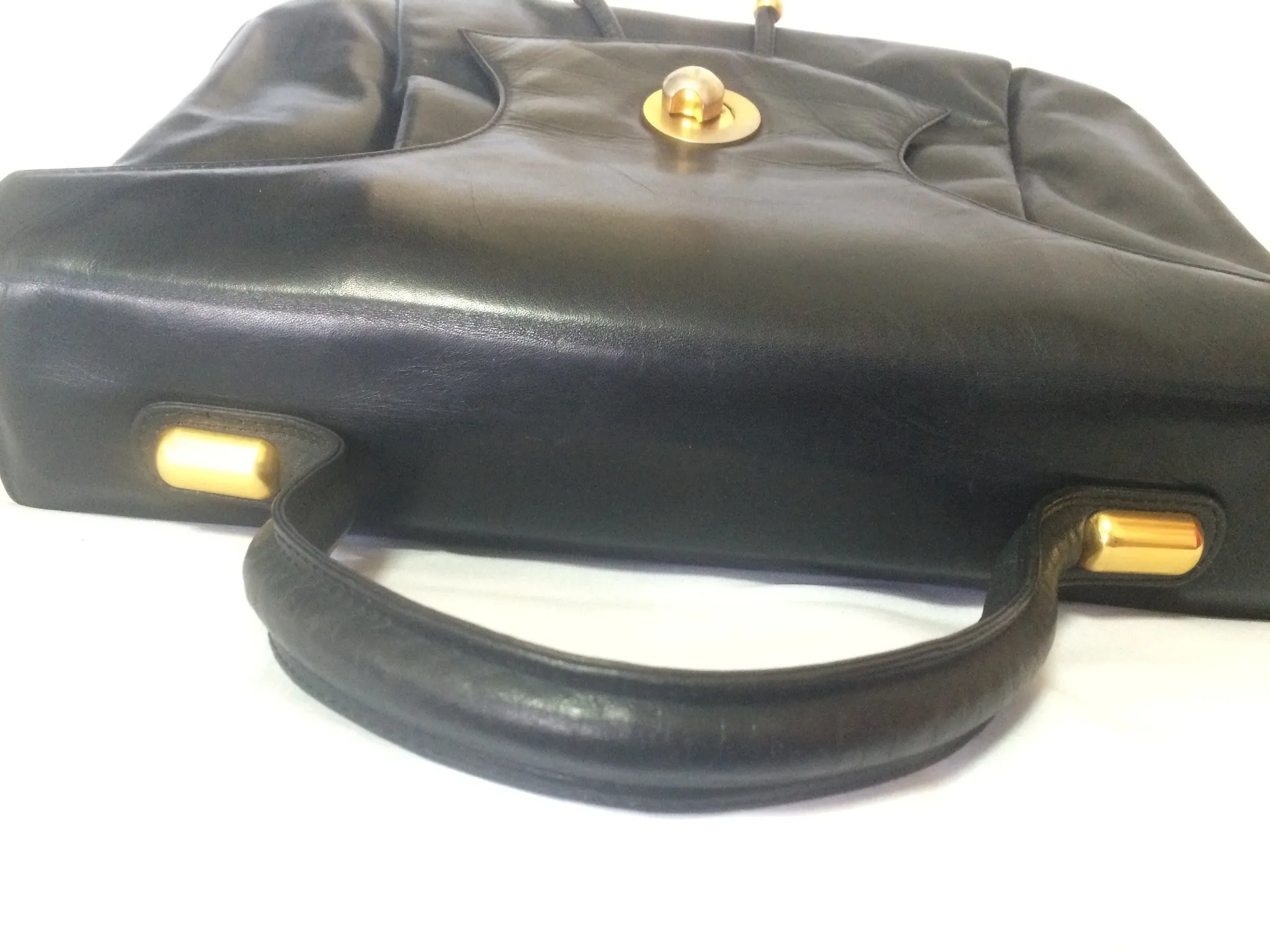 Vintage Bally black leather retro pop design bag, business purse with gold tone drawstrings and unique flap cut design.  Unisex use. 160315
