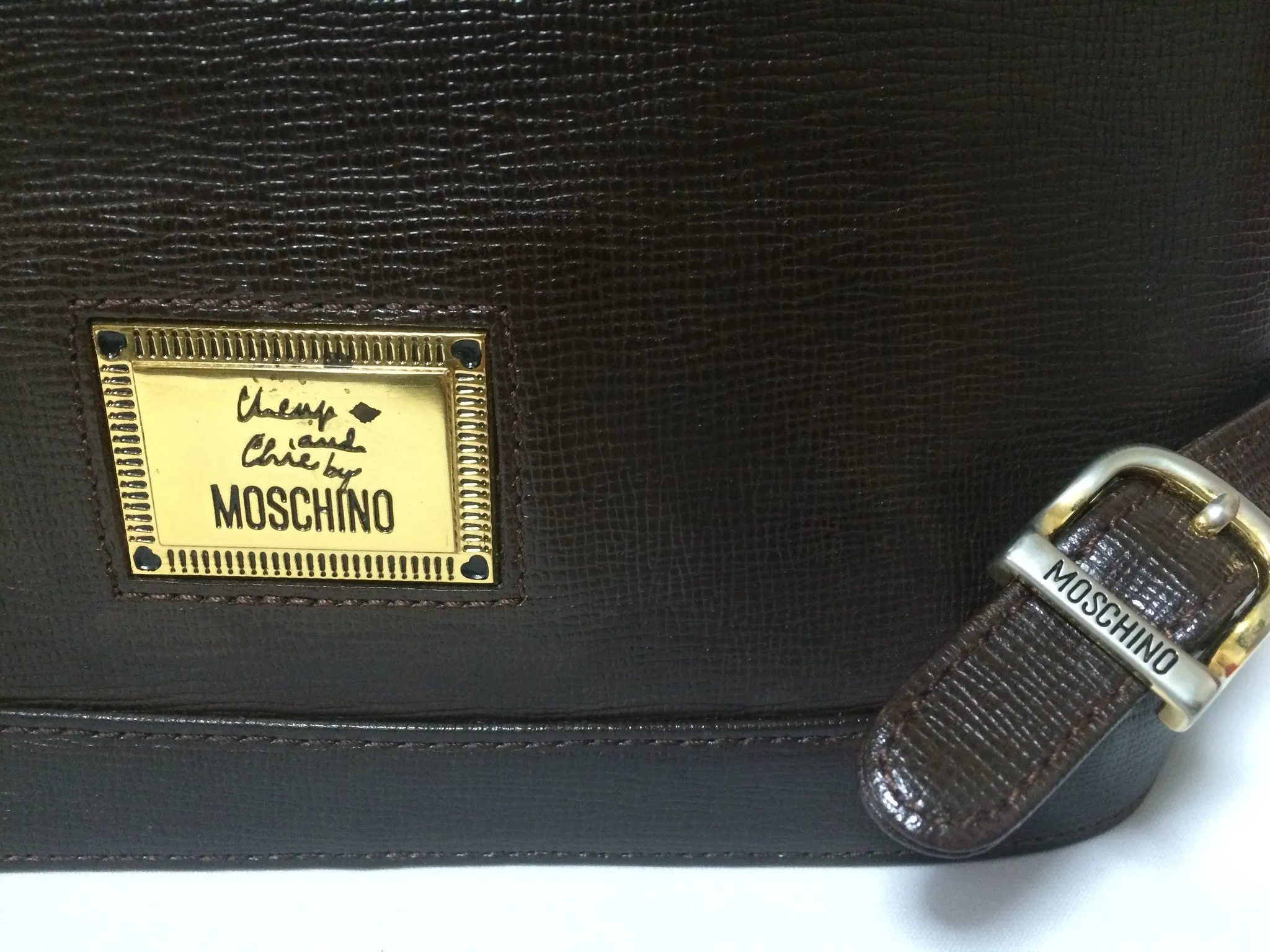 Vintage MOSCHINO genuine dark brown leather backpack with golden and black M logo motif from cheap and chic by moschino. Perfect daily bag. 060528r1
