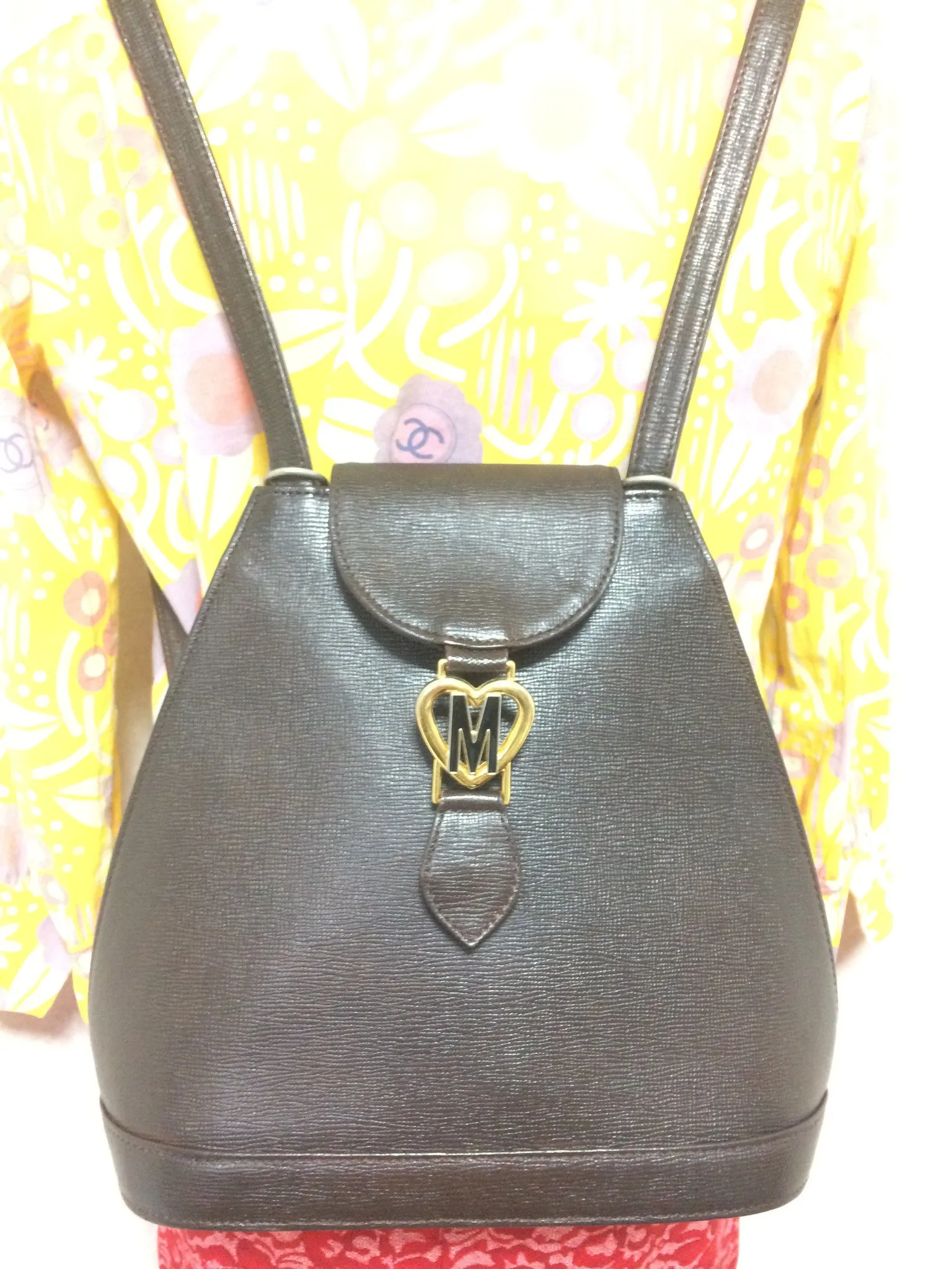 Vintage MOSCHINO genuine dark brown leather backpack with golden and black M logo motif from cheap and chic by moschino. Perfect daily bag. 060528r1